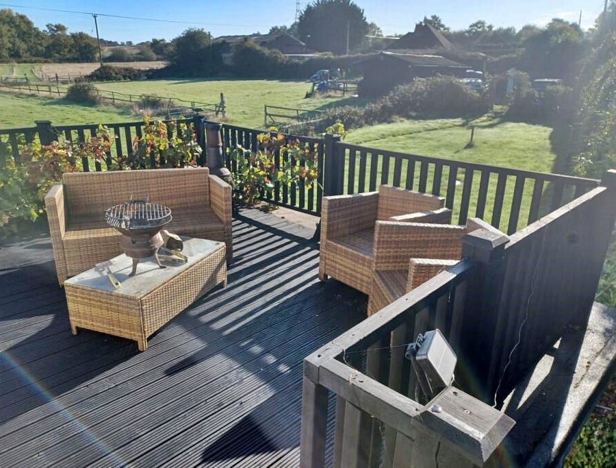 Story from Jam Press (House Listing Feet) Pictured: The outdoor area of the four-bed house on the market for ¿785,000. Toe-tally bizarre! Four-bed house selling for ¿785,000 but pair of bare feet on display A four-bedroom house is selling for ¿785,000 - but a pair of bare feet were spotted on display. The seemingly ordinary cottage was built in the 17th century. The estate agents say the rural property possesses ¿great charm.¿ But something appears to be afoot in one of the snaps. Someone is sitting on the sofa in the lounge. And their tootsies are on show next to two bottles of beer. The pad also has a Tiki bar and a hot tub outside. It also comes with a portacabin being used as a vet's and space for grazing. The house is located in Wimborne, Dorset. The owner is selling up as they¿re planning to emigrate abroad. It¿s being sold by Purple Bricks and advertised on Rightmove, as reported by Luxury Property News. The listing reads: ¿Amazing and rare, affordable opportunity in this popular area. ¿Located in a very popular rural village, with schools and about two miles from Upton Beach. ¿Only a few properties have this amazing access. ¿Freehold four-bedroom cottage, with great charm and original 17th century, with extended and no Grade II Listing now. ¿Large garage with inspection pit. ¿Stable block with tack room. ¿A total of four to eight acres of grazing. Two portacabins are used as a vet surgery and pet grooming parlour. ¿Off-road parking and standing for a horse box by the garage, and even a Tiki Bar. ¿Security cameras all around, lovely neighbours and a country pub over the road. ¿Easy access to Poole and Wimborne - five mins on A31 or A35, Bournemouth - 15 to 20mins. ¿Great local facilities in the area, schools, bus and train. The Jurassic coast is gorgeous, a fab area. ¿Selling up to retire overseas, but very sad to leave this wonderful location." ENDS