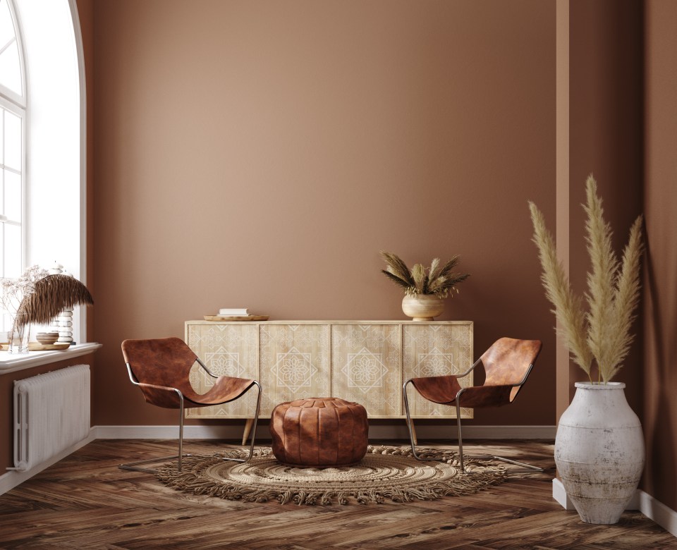 Illustration of a living room with ethnic boho decoration in brown warm colors.