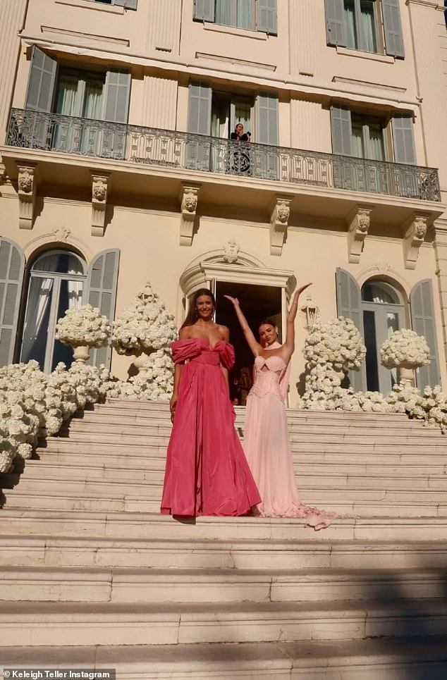 The friends coordinated with the famous rose-hued hotel with the grand entrance steps covered in thousands of florals