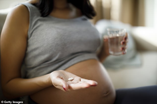 Tylenol is widely used by pregnant women, with estimates suggesting 60 percent take the drug during their pregnancy to help reduce fevers and pain (stock image)