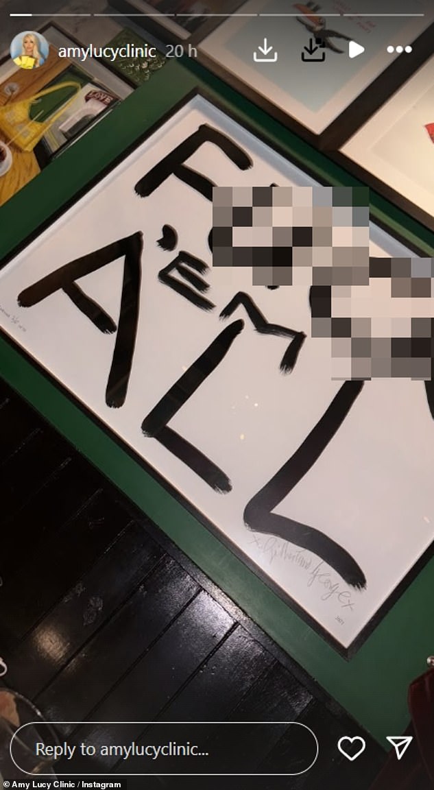Now Amy-Lucy has shared a picture of artwork that read, 'F*** 'EM ALL' painted in large black writing
