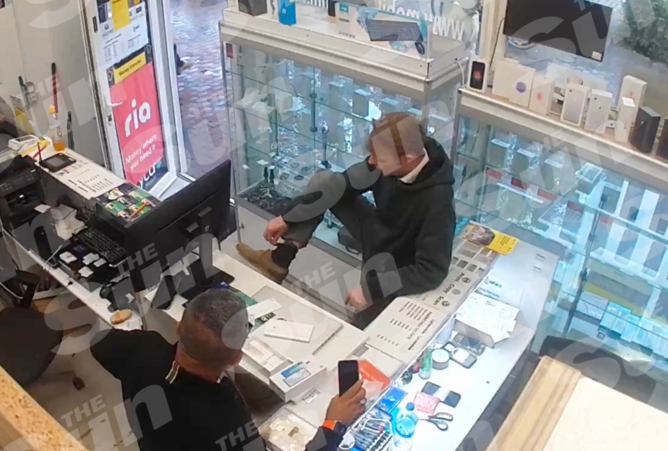 CCTV footage showing Christian Brueckner, a suspect in the disappearance of Madeleine McCann, showing off his ankle tag to a shop owner in Neumünster, Germany.