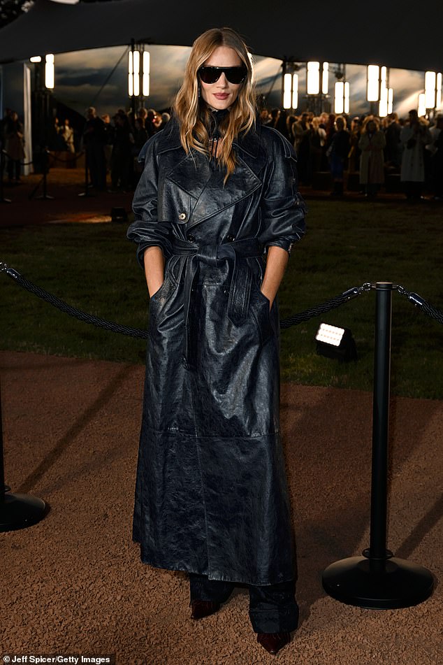 Rosie, 38, oozed effortless style in a dark navy blue leather trenchcoat, cinched with a coordinating belt