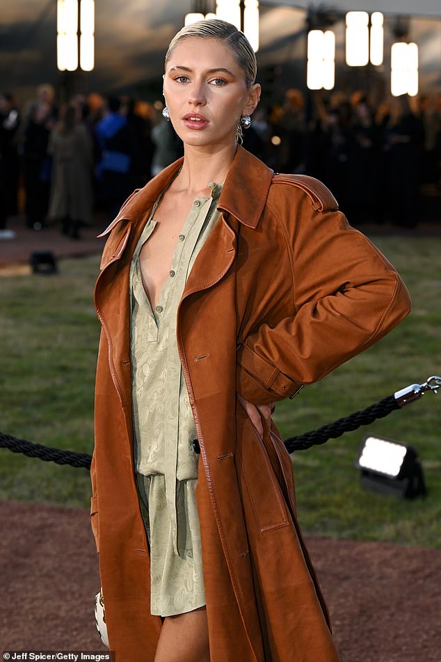 While Iris, 24, opted for a more laidback look, slipping in an oversized silk shirt dress embossed with a paisley pattern and left unbuttoned daringly low