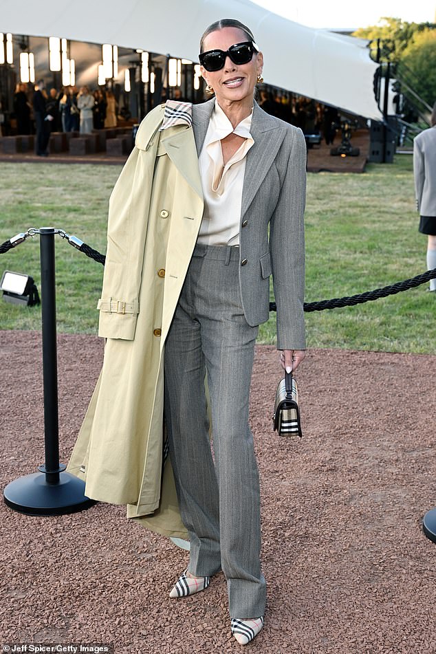 The actress displayed her impeccable taste in tailored striped suit and silk shirt, underneath a classic Burberry trenchcoat, with a matching check patterned handbag and heels