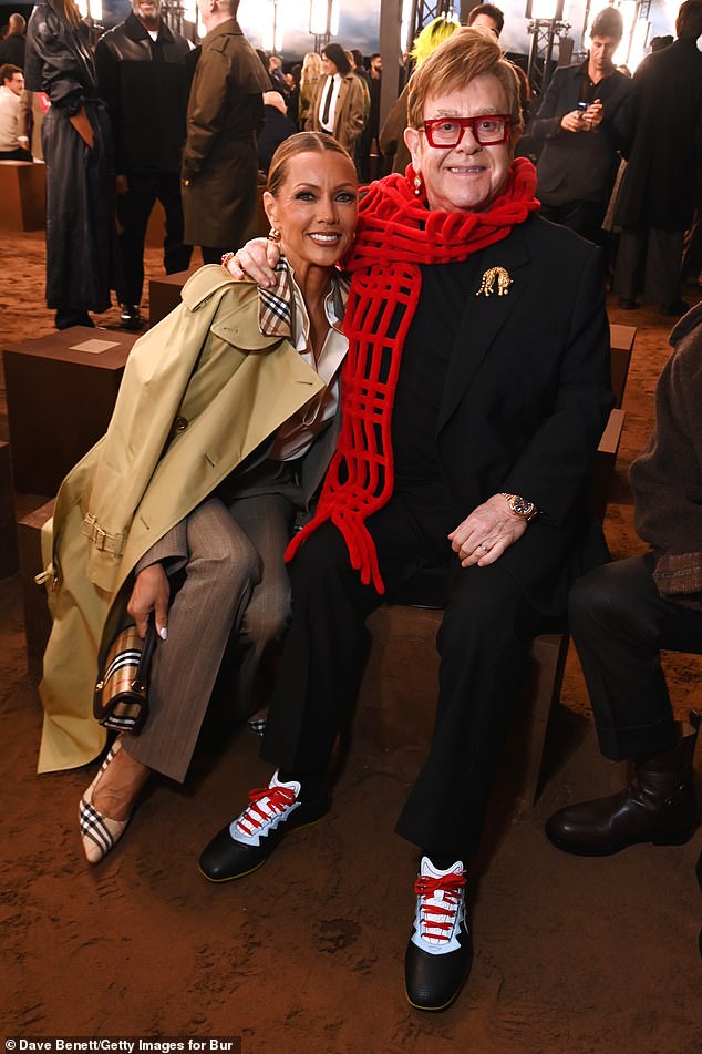 The iconic singer, 78, donned a red pair of his favourite bold glasses and a quirky matching scarf, while pinning a gold tiger brooch to his jacket.