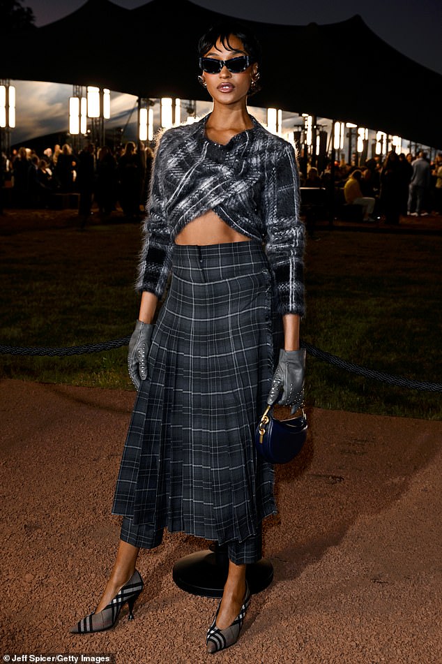 But Jourdan Dunn ensured all eyes were on her, as she displayed her chiselled abs in a cropped wrap-around cardigan