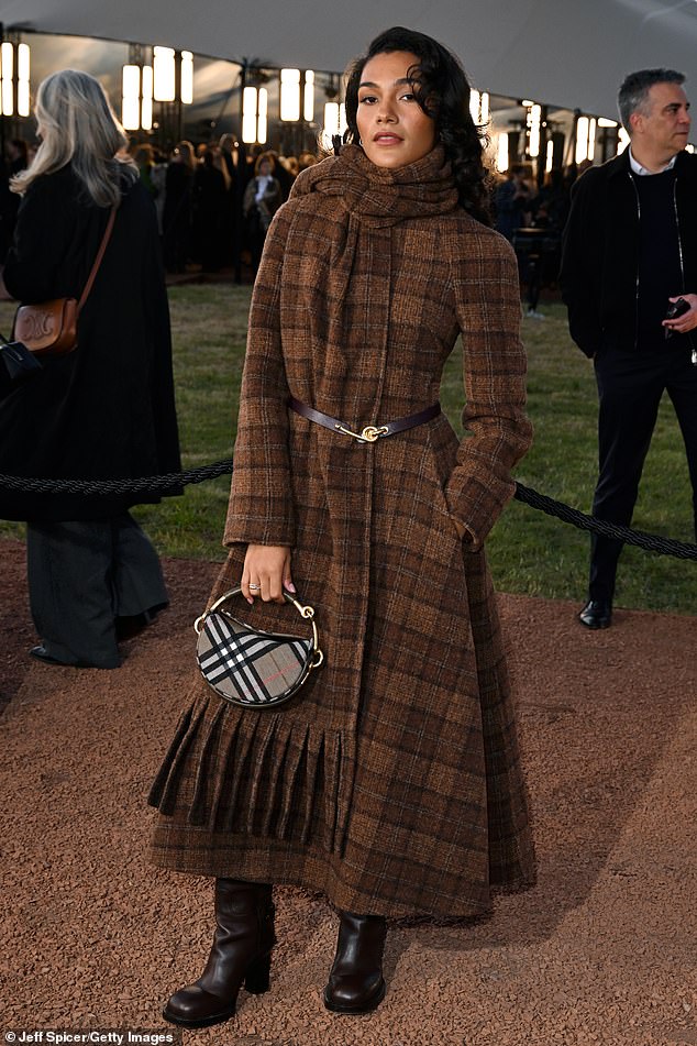 Olivia Dean pulled off one of the best looks of the night in a brown checked coat dress that she teamed with a matching woollen scarf and thin belt