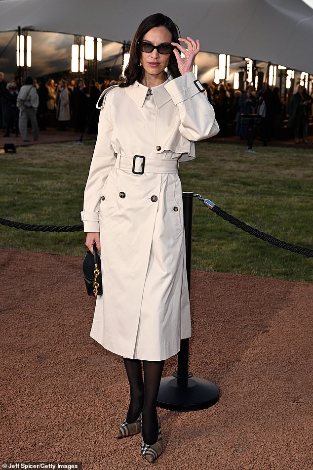Alexa Chung also showed her fashion prowess in a chic white coat with an eye-catching pointy collar and matching belt