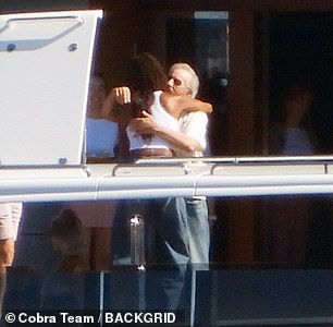 Spielberg is seen embracing Michelle upon her arrival