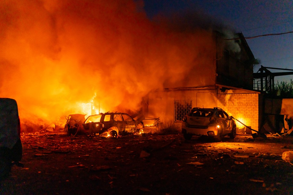 Houses and cars ablaze after a Russian attack in Zaporizhzhia, Ukraine.