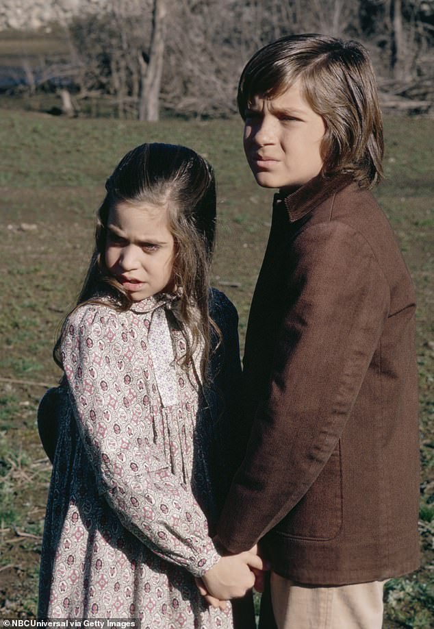 Host Sean Evans replied: 'There was a hazing ritual on Little House on the Prairie?' to which Bateman answered: 'Yeah' - pictured with Missy Francis as Cassandra Cooper Ingalls