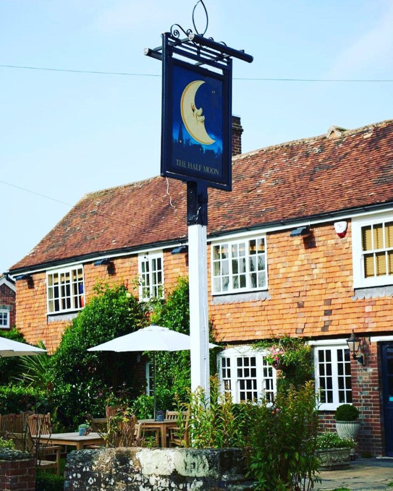 The Half Moon pub with outdoor seating.