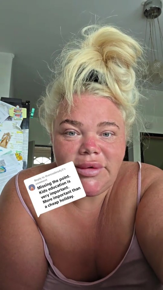 A woman with blonde hair in a messy bun looking at the camera, with a comment bubble overlaying her chest area that reads "Missing the point. Kids education is very important. More important than a cheap holiday."
