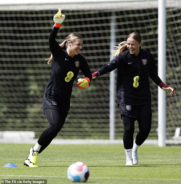 Hampton was the understudy for England legend Earps before replacing her - here they are pictured celebrating together in training back in 2022