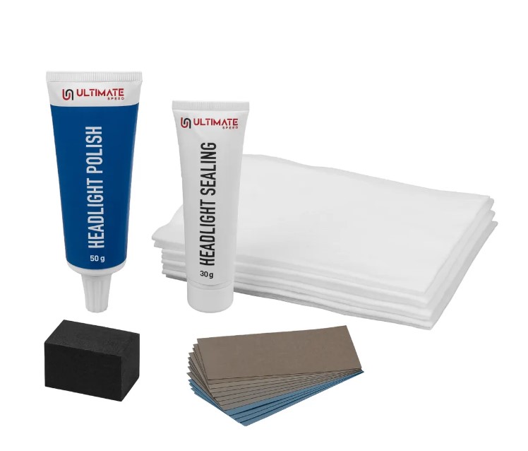 Ultimate Speed Headlight Restoration Kit, a 19-piece set including tubes of headlight polish and sealant, a polishing block, sanding paper, and cloths.