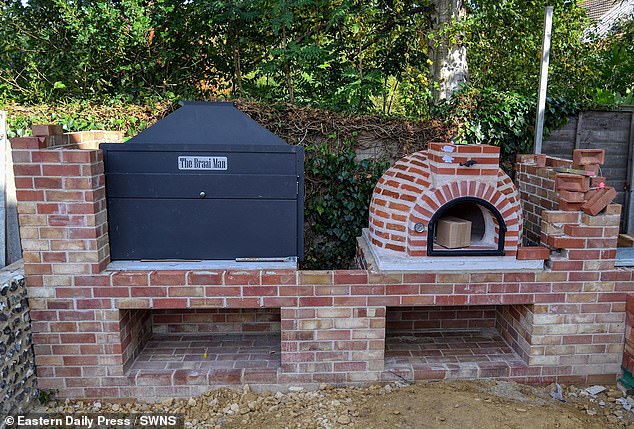 A hot tub and outdoor kitchen area with a pizza oven and BBQ (pictured) have also been added to the former youth hostel development