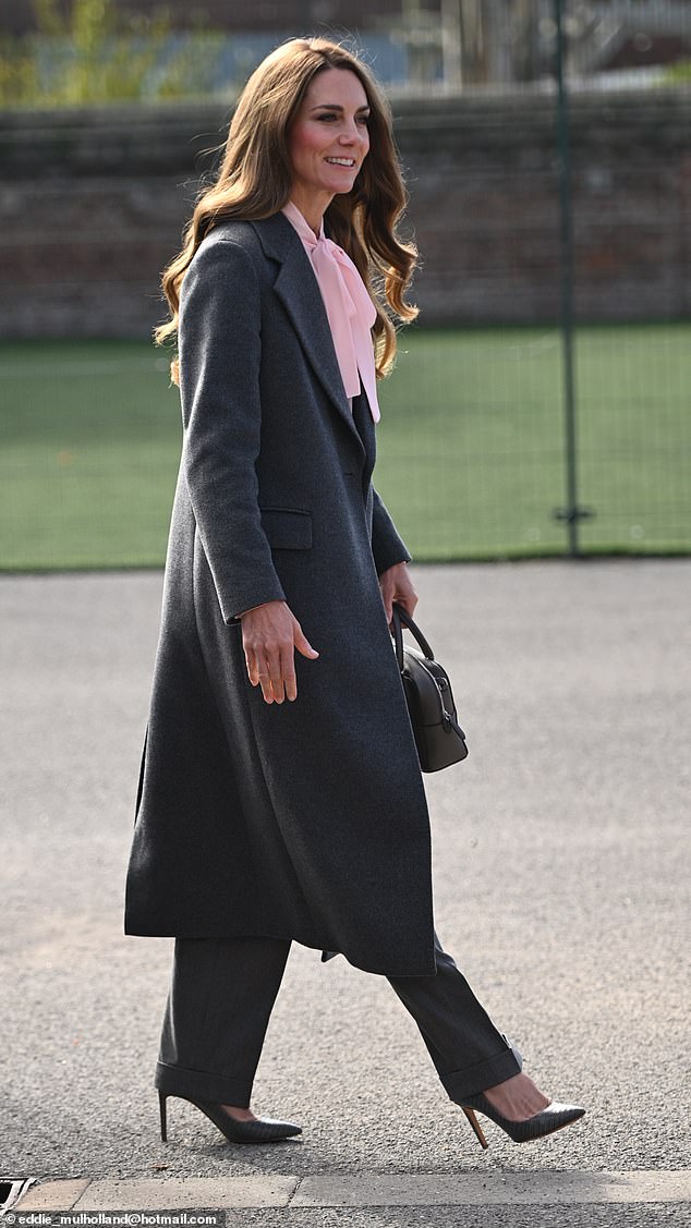 Kate opted for a smart trouser and coat co-ord, teamed with a pink blouse for the outing today