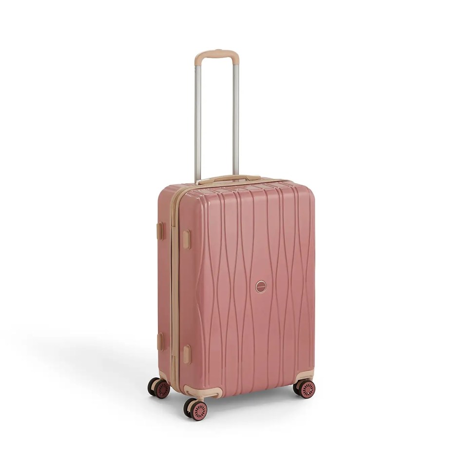 Pink cabin-sized suitcase with an extendable handle.