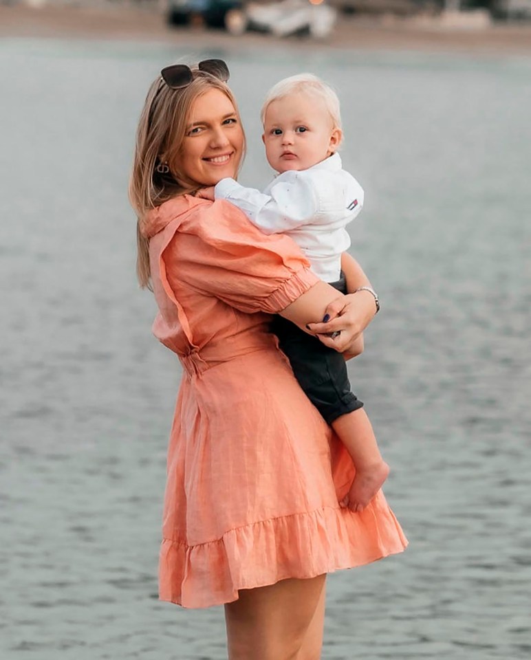 Anastasiia Chikina holding her son Oliver Pugh in Marbella, Spain.