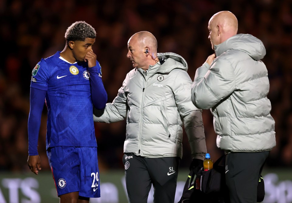 Chelsea player Wesley Fofana receives medical treatment during a Carabao Cup match.