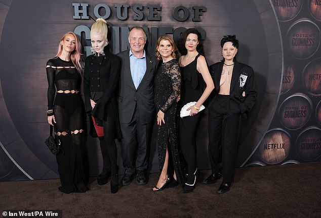 Lady Mary Charteris, Daphne Guinness, Lord Ned Iveagh, Ivana Lowell, Jasmine Guinness and Celeste Guinness put on an eccentric group display as they posed on the appropriately dark-brown carpet (pictured L-R)