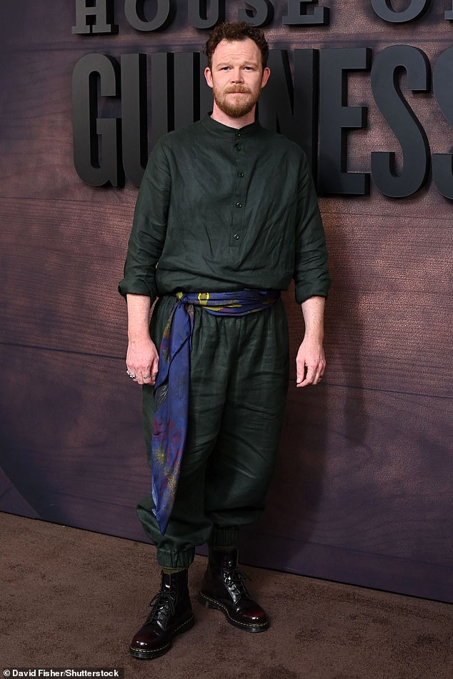 Patrick Cochrane actor Seamus O'Hara stood out from the crowd in a forest green shirt and trousers, with a colourful scarf wrapped around his hips