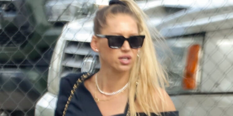 Rarely-seen tennis legend Anna Kournikova, 44, shows off growing baby bump months after health scare