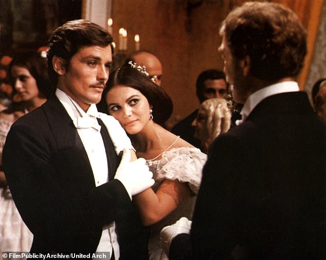 She is pictured leaning on French heartthrob Alain Delon in Luchino Visconti's sweeping 1963 period drama The Leopard, which was a major influence on The Godfather