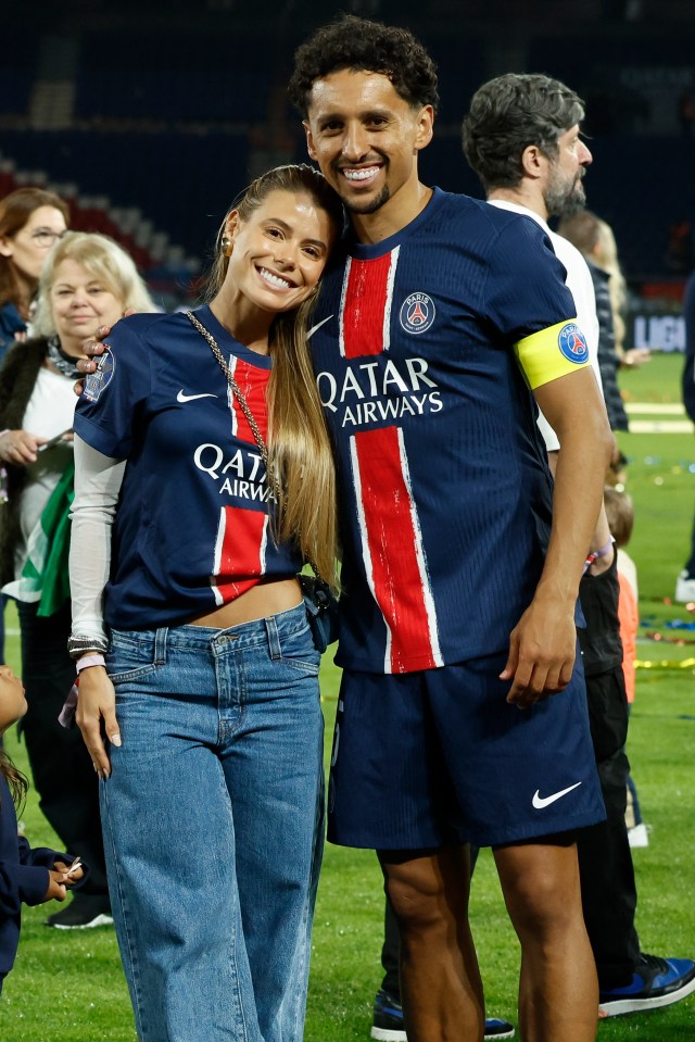 Marquinhos and his wife, Carol Cabrino, celebrate the Ligue 1 trophy.