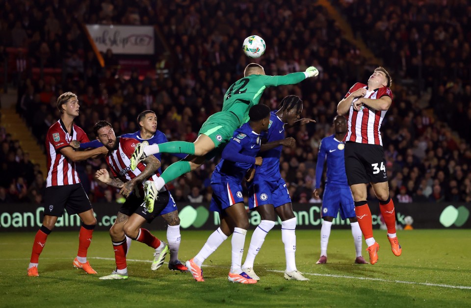 Chelsea goalkeeper Filip Joergensen fails to intercept a cross during the Carabao Cup Third Round match.