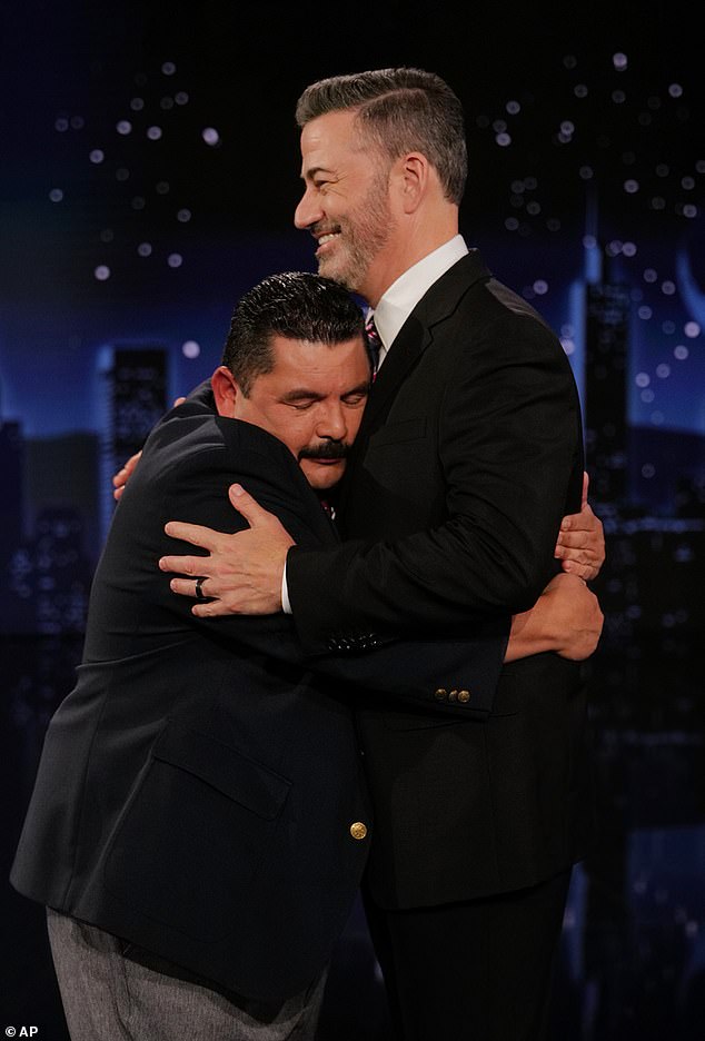 'It was never my intention to make light of the murder of a young man,' he said, fighting back tears. 'I don’t think there's anything funny about it'; Kimmel seen with sidekick Guillermo Rodriguez