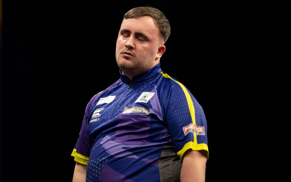 GLASGOW, SCOTLAND - FEBRUARY 15: Luke Littler looks dejected during a BetMGM Premier League Darts match against Gerwyn Price at the OVO Hydro, on February 15, 2024, in Glasgow, Scotland. (Photo by Ross MacDonald / SNS Group)