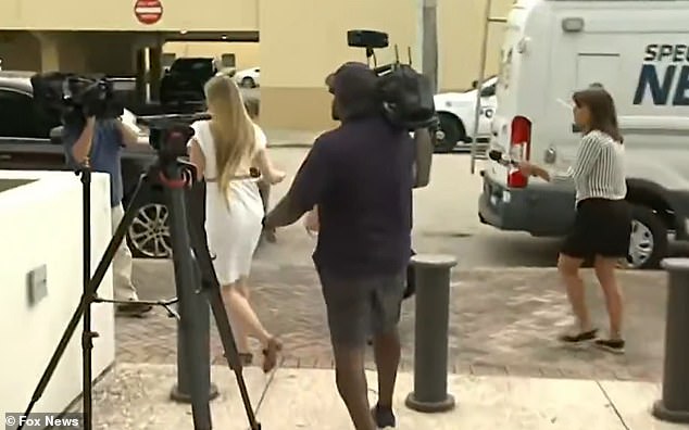 Outside, she was approached by camera crews hoping to speak with her about the decision
