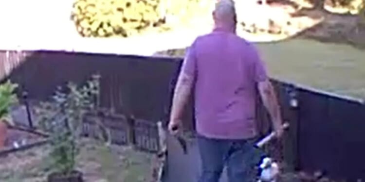 Horrific moment thug attacks next door neighbours with KNIFE and scaffolding pole in petty row over boundary fence