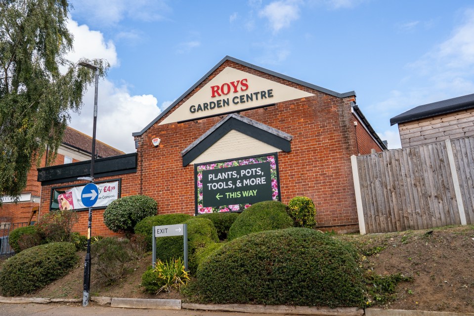 Roy's Garden Centre, a brick building with a sign for plants, pots, tools, and more.