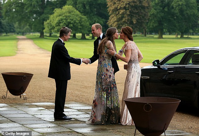 William and Kate are greeted by David Cholmondeley, Marquess of Cholmondeley and Rose Cholmondeley, the Marchioness of Cholmondeley as they attend the gala