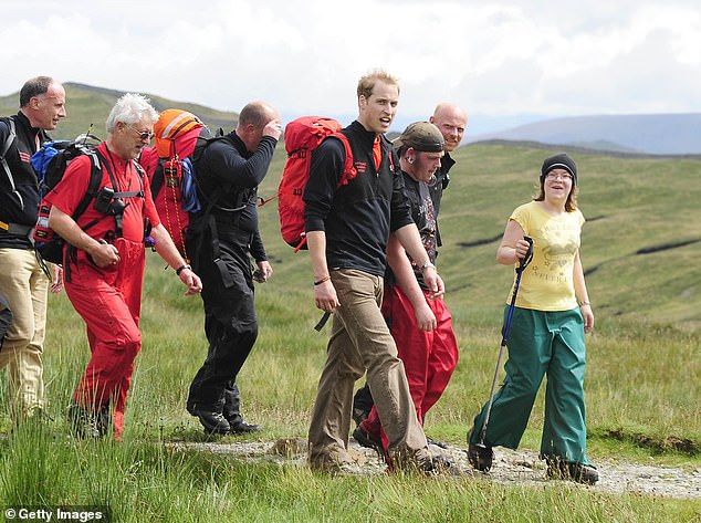 William is pictured walking with a group of homeless young people helped by Centrepoint on a fell walk on July 24, 2009, in Cumbria
