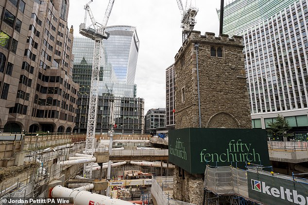The historic All Hallows Staining Church is seen surrounded by ongoing construction work