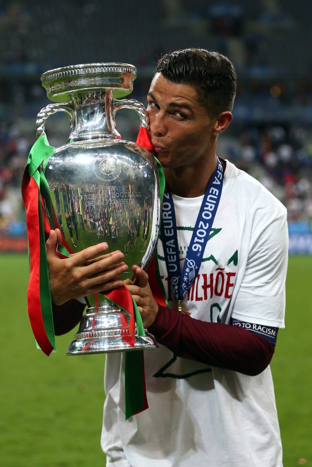 Cristiano Ronaldo of Portugal kisses the UEFA Euro 2016 trophy.