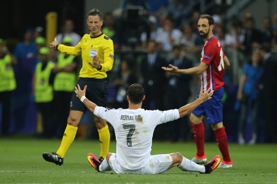 Cristiano Ronaldo of Real Madrid protesting to Referee Mark Clattenburg during the UEFA Champions League final match.