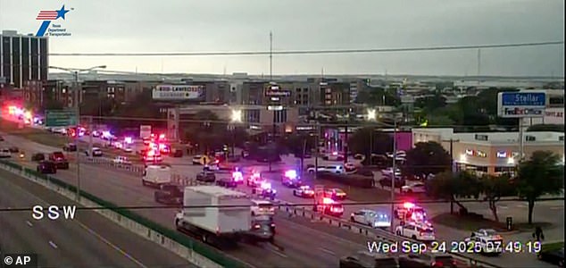 This traffic camera image shows  heavy police presence off I-35E close to a U.S. Immigration and Customs Enforcement office, in northwest Dallas on Thursday, Sept. 24, 2025.  (WFAA via AP)