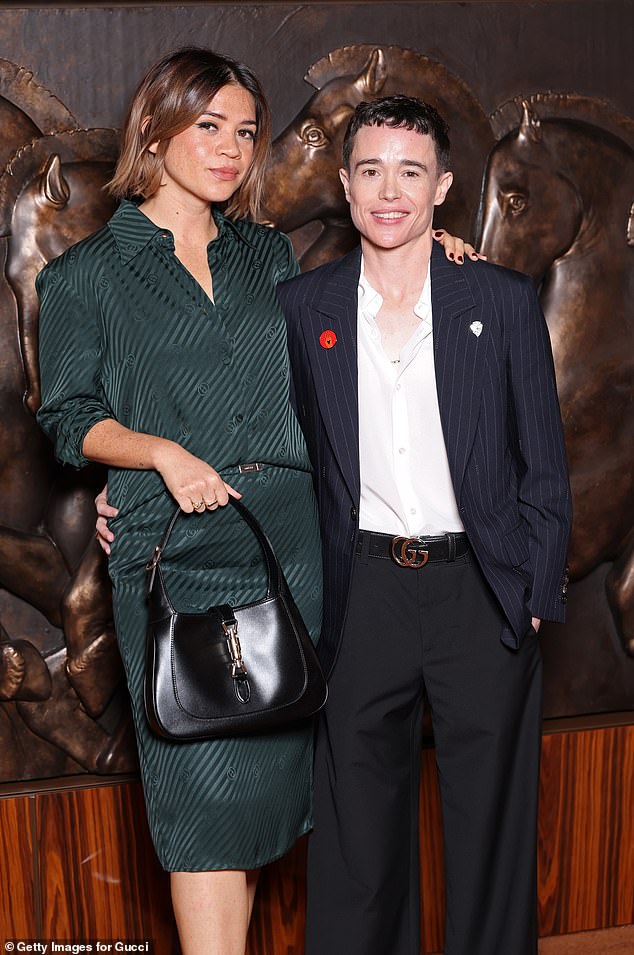 Julia opted for a forest green striped blouse with a matching skirt and added height to her frame with a pair of black open toe heels