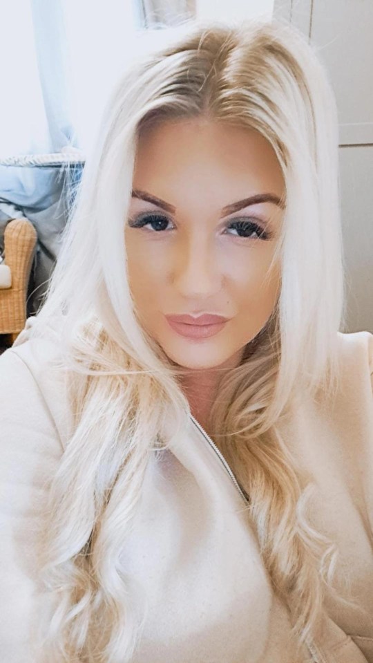 A headshot of Karlene Warner, a woman with long blonde hair, looking directly at the camera.
