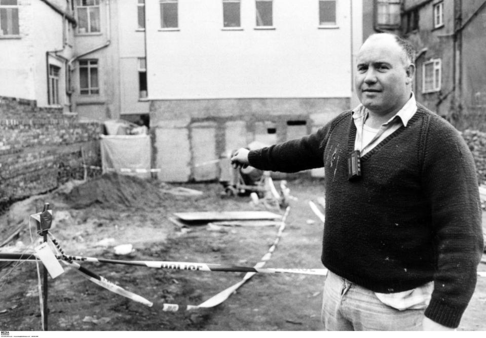 Paul Bodenham pointing at the corner of a yard where a decomposed body was found.