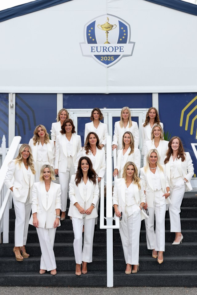 Partners and wives of Team Europe players posing for a photo.