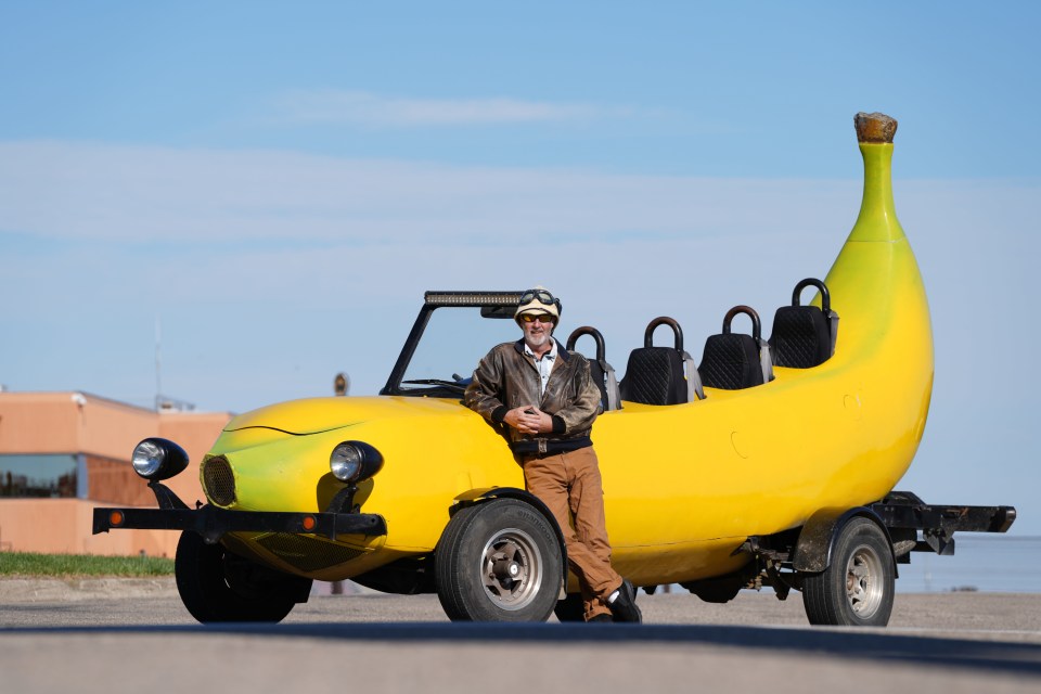 Steve Braithwaite stands next to his record-holding banana car.