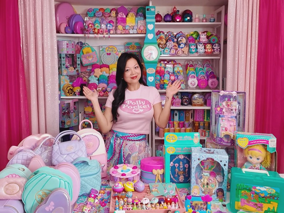 Abby Taylor with a large collection of Polly Pocket toys.