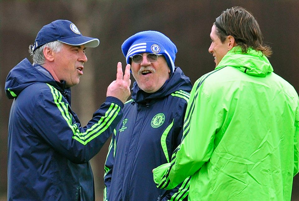 Chelsea manager Carlo Ancelotti gestures while speaking to Fernando Torres during a training session.