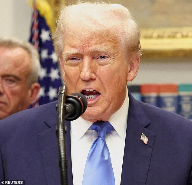 President Donald Trump, in front of U.S. Secretary of Health and Human Services Robert F. Kennedy Jr., delivers remarks linking autism to the use of popular pain medication Tylenol for pregnant women and children